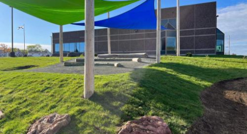 Sail shaped sunshade hang in from of the Fundy Geological Museum.